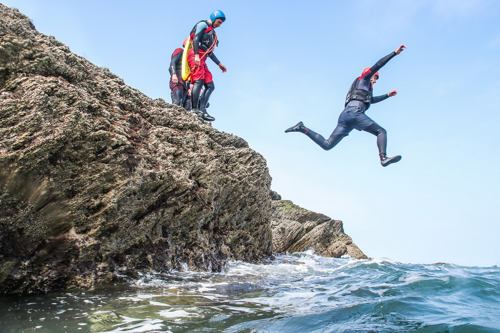 Jumping off Rocks at Croyde Bay Coasteering