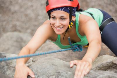 climbing up Rocks at Croyde Bay Coasteering